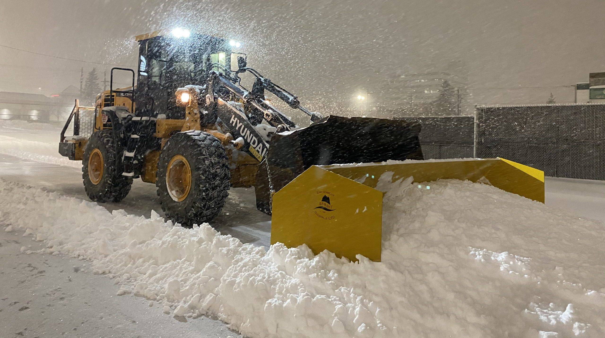 Hyundai front end loader pushing snow snow removal